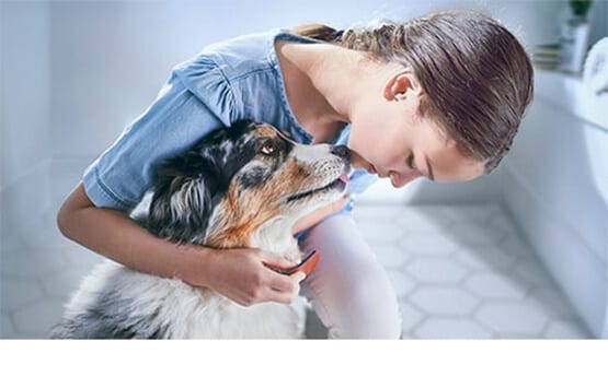 Girl petting a dog